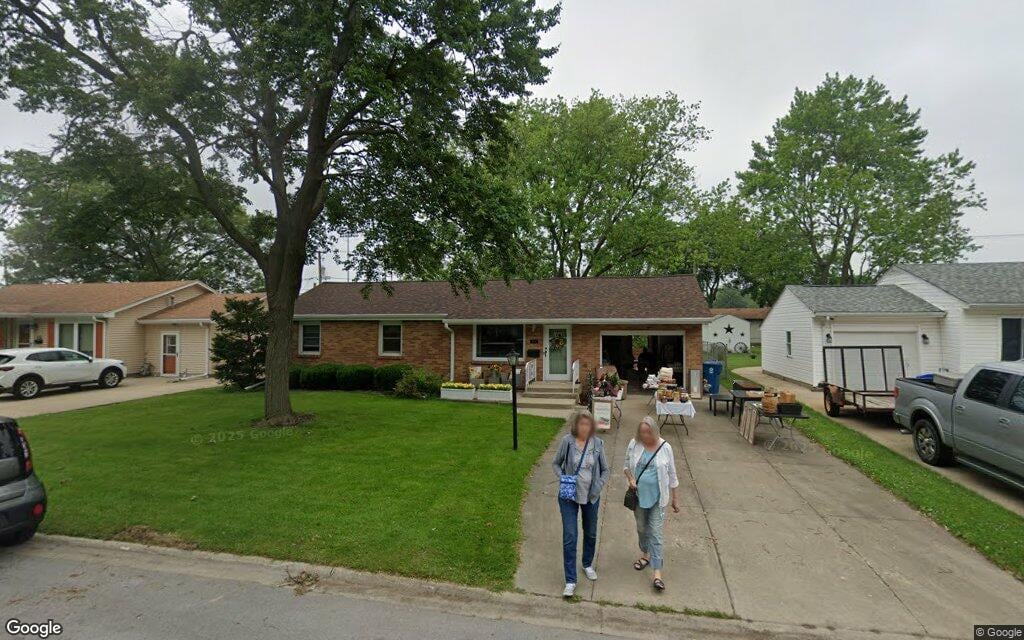 Charming single-family home with a manicured lawn under a clear sky in Bradley, Illinois